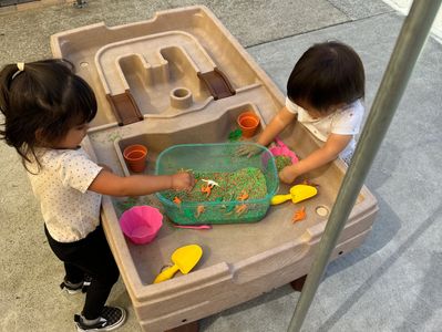 children playing with sensory table