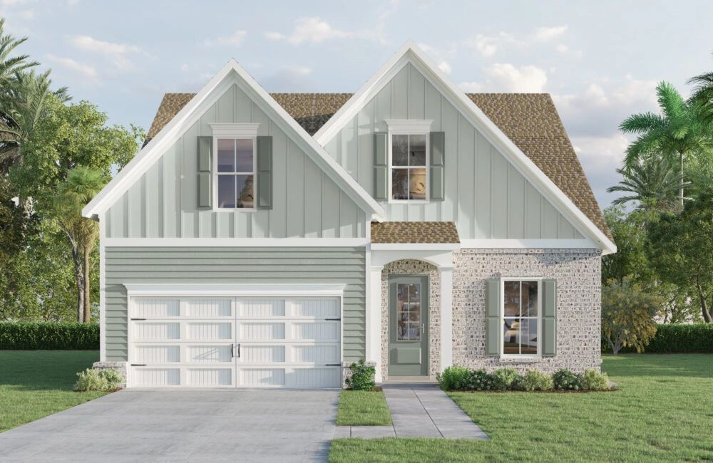 Modern two-story house with green siding and brick accents.