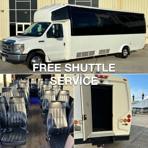 White shuttle bus with black tinted windows offering free shuttle service.