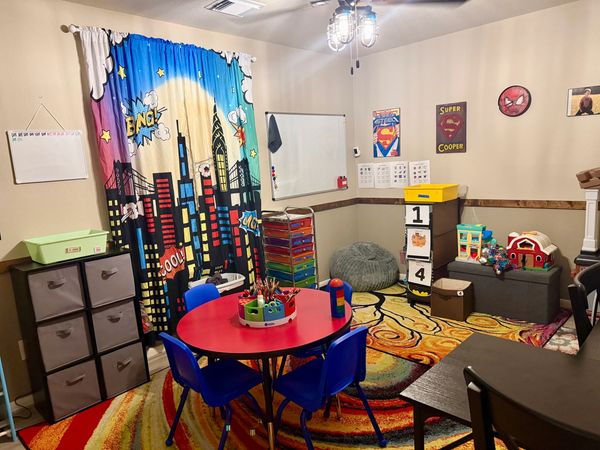 Colorful and organized children's playroom with educational and fun elements.