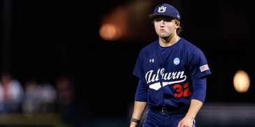 Baseball player in Auburn jersey on field.