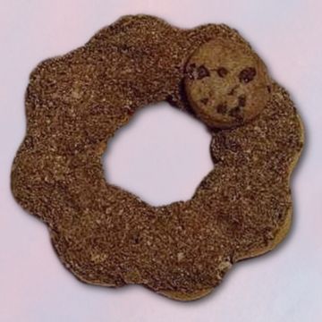 A sesame-covered ring-shaped bread with a small round face-like piece attached.