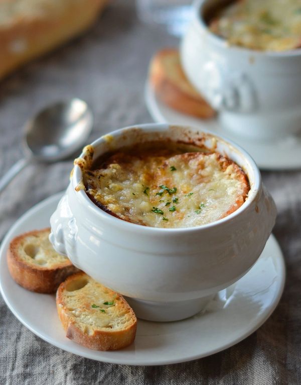 French onion soup with toasted bread slices.
