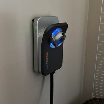 EV Charger installed on wall in garage