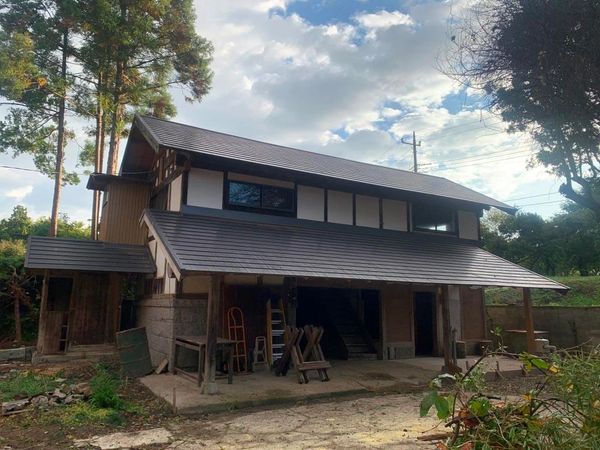 Traditional rustic house with a slanted roof.