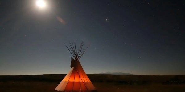 Blackfoot tipi at Writing-on-Stone / Áísínai’pi, reflecting cultural presence and continuity.