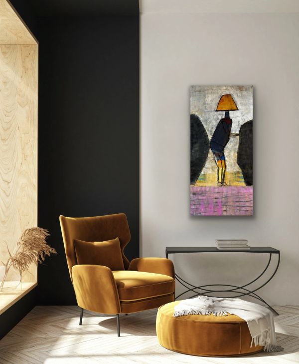 Modern living room with mustard armchair, ottoman, and abstract wall art.