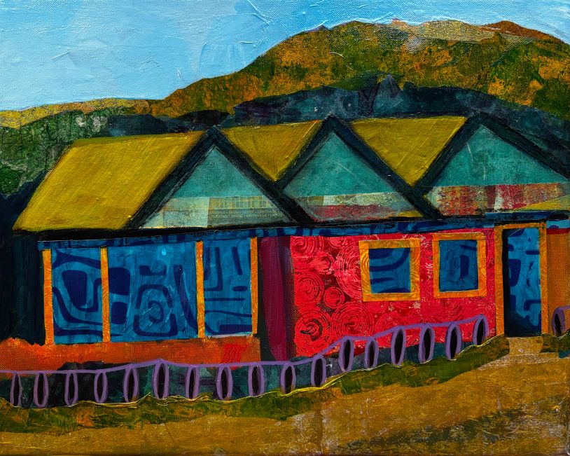 Colorful abstract houses with a mountain backdrop.