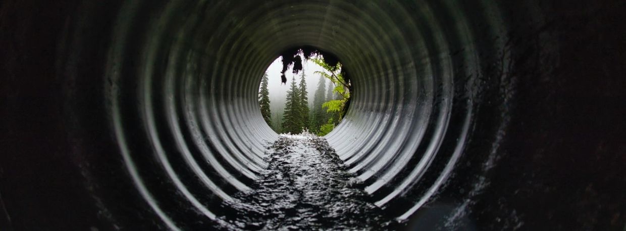 Water running through sewer pipe