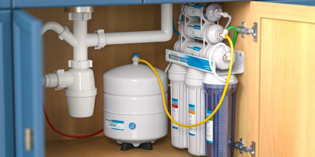 Water filtration system installed under kitchen sink cabinet
