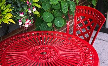 Red coated patio table by Skull Island Kustoms
