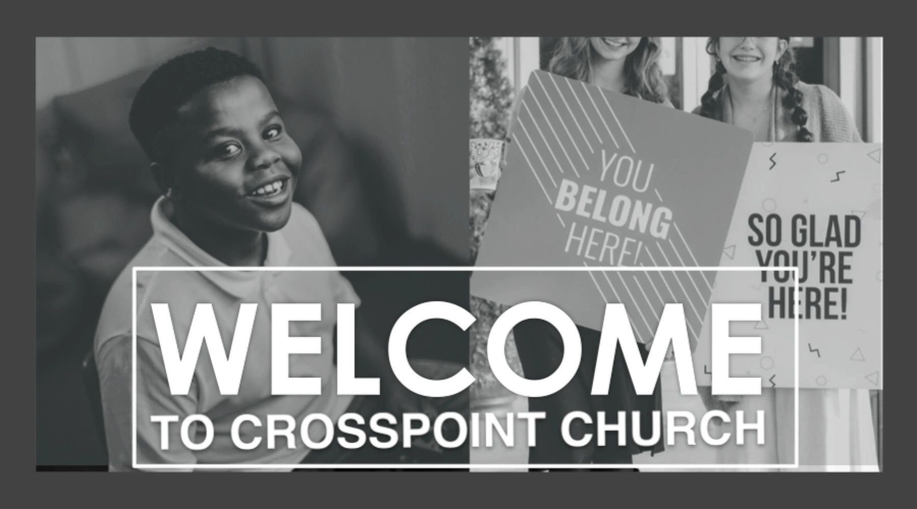 Smiling children holding welcome signs at Crosspoint Church.