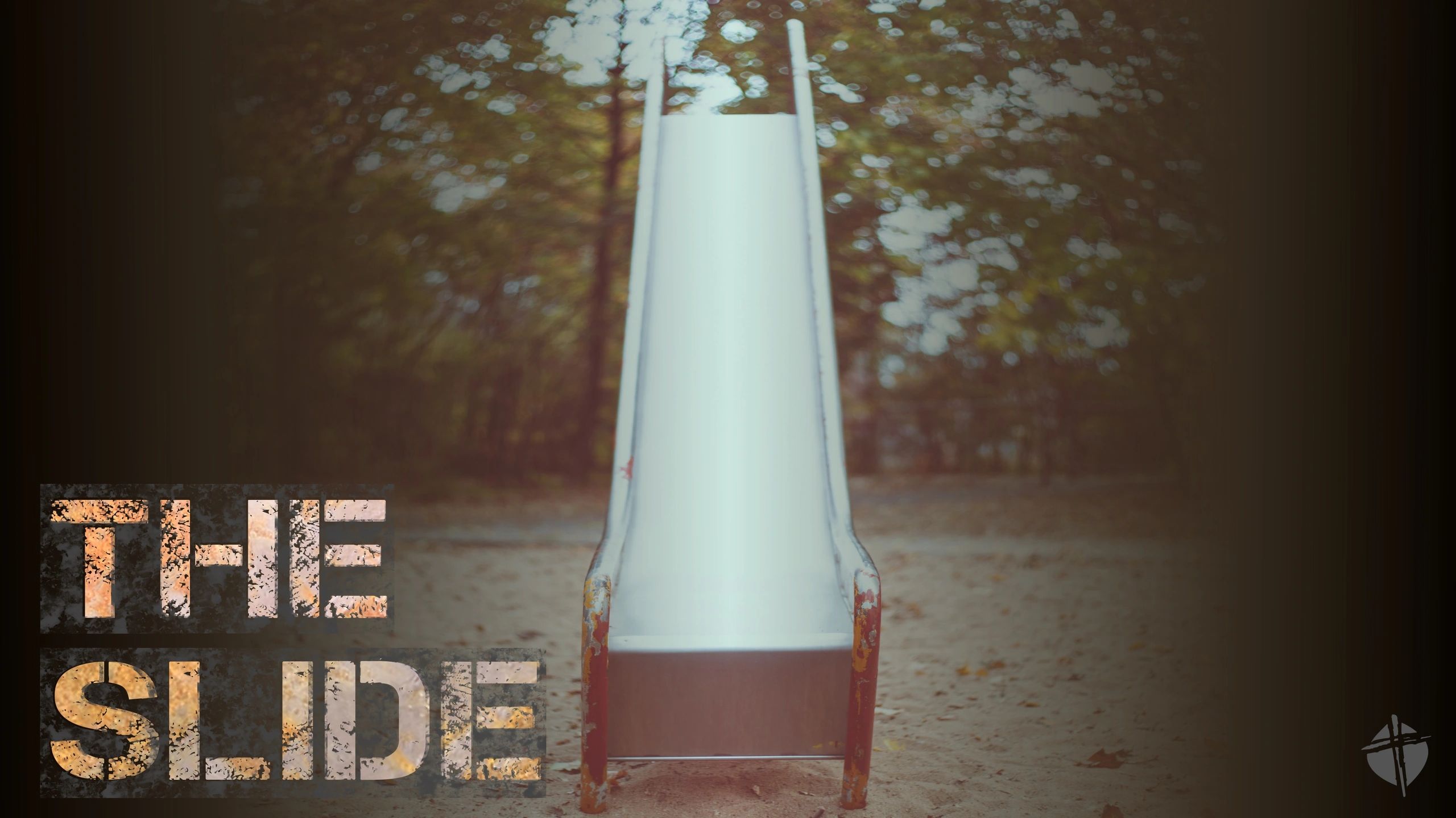 A weathered slide in a quiet, autumnal park.