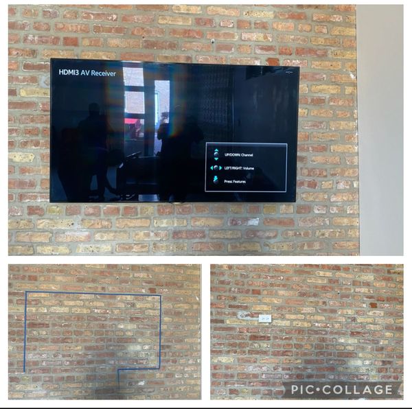 TV installed on a brick wall with an added outlet.