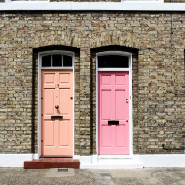 two pink doors on a brick building symbolizing personal choice and growth--Ocala therapy