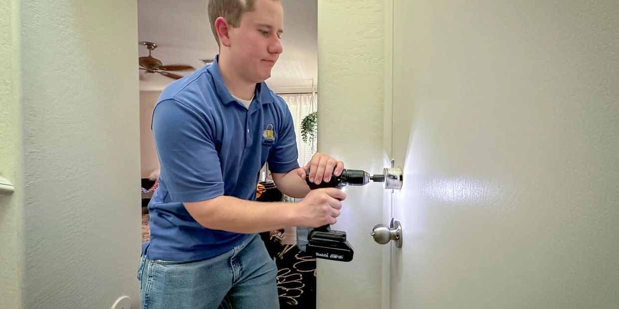 A blank door needing a hold for a deadbolt being installed by professional local locksmith