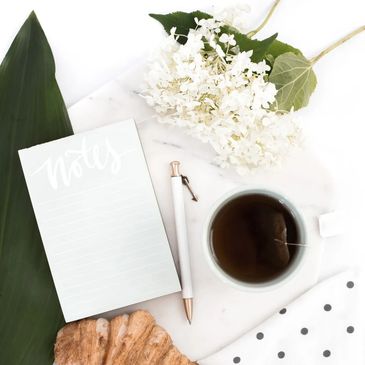 Notebook and tea on a table