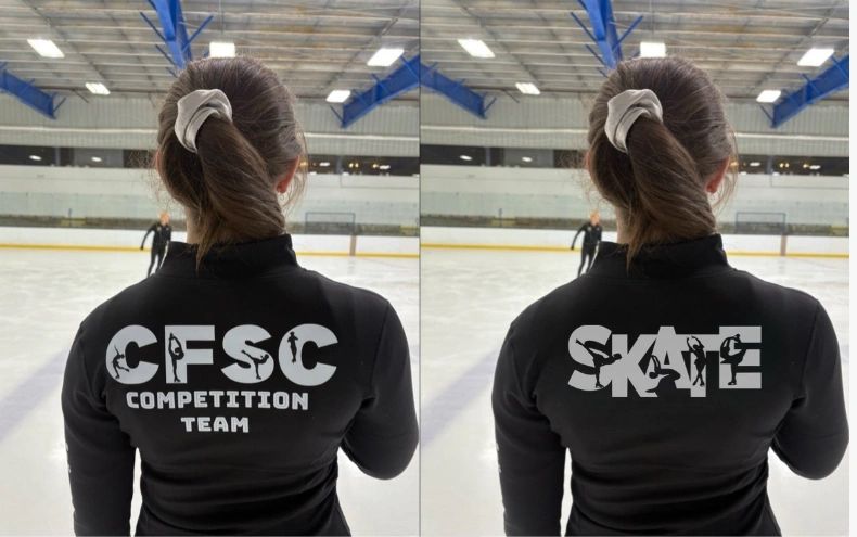 Figure skater with CFSC Competition Team and SKATE logos on jacket in ice rink.