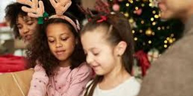 Children wearing festive headbands at a holiday gathering.