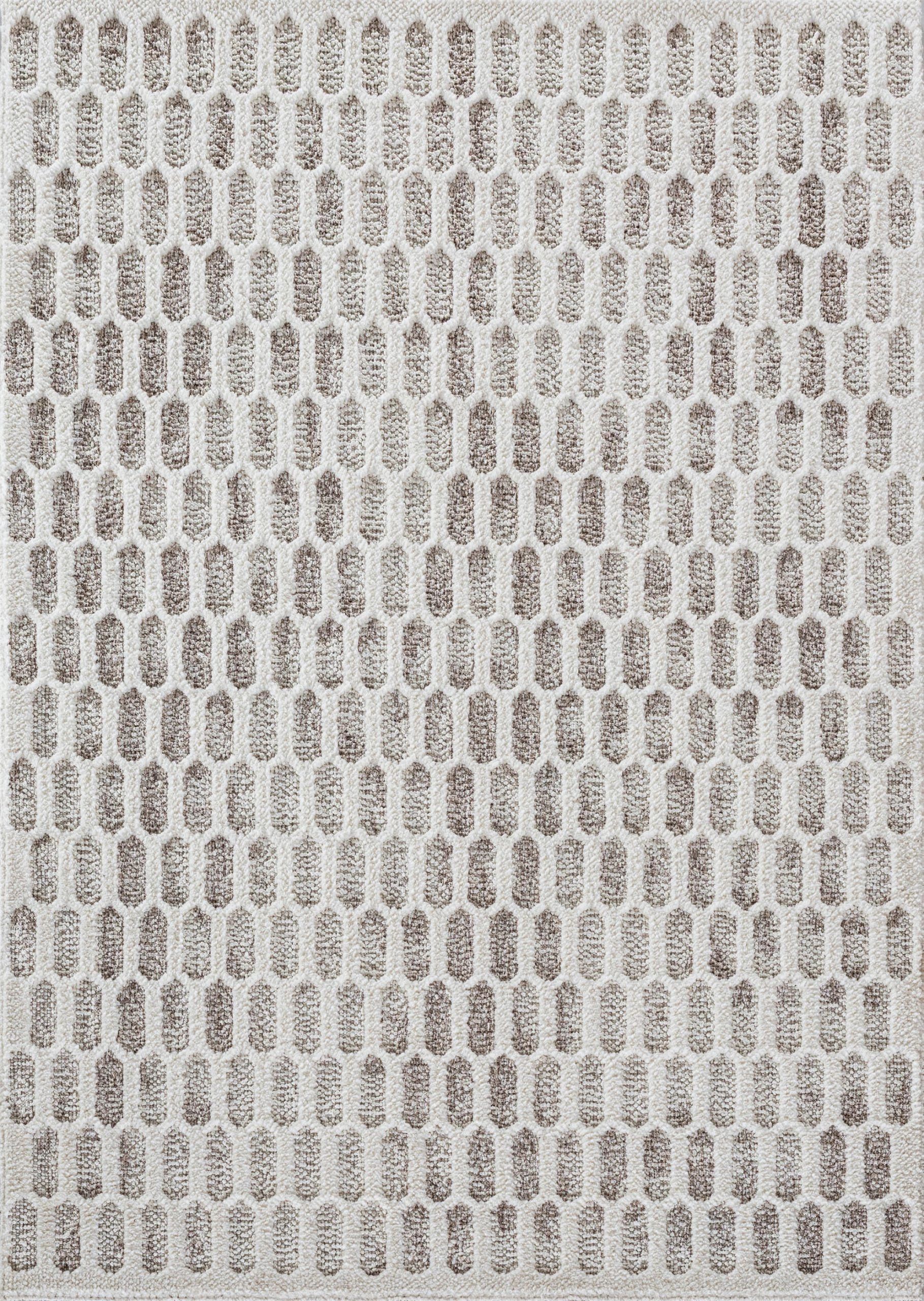 Textured beige and white patterned fabric with raised oval shapes.