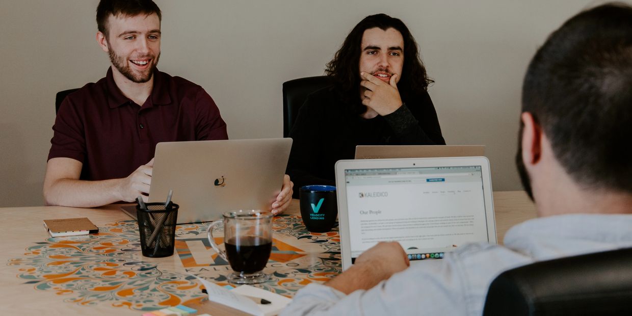 A group of men having a meeting