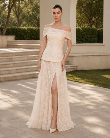 Woman in an elegant off-shoulder beige gown.