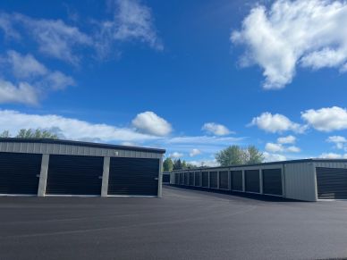 Outdoor storage units under a blue sky.