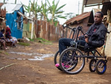 Michael in his chair in the slum outside Nairobi 