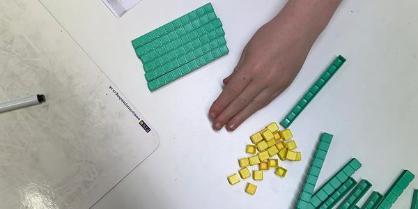 Child using concrete resources to learn maths in Progress Tutoring Ormskirk and Aintree.