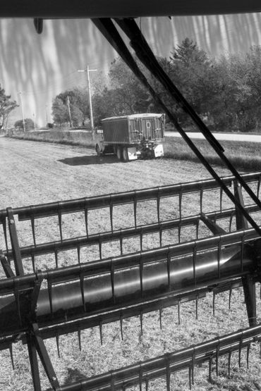 Corn harvest with truck in Iowa field from combine. - Editorial Photography by S&C Design Studios