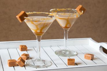 Salted Caramel Martini on white tray with caramel candy. - Cocktail Photography by S&C Design Studios