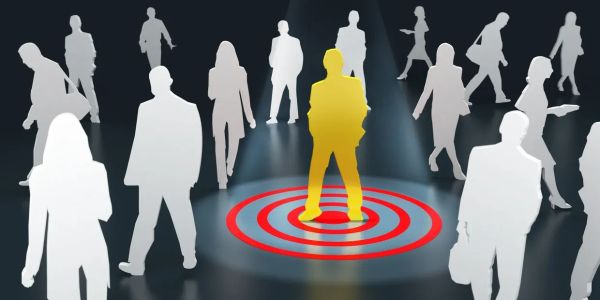A golden figure stands in red target rings among white silhouettes.