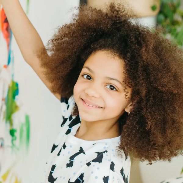 A child enjoying painting at an individual art therapy session with Meghan Havlin LLC