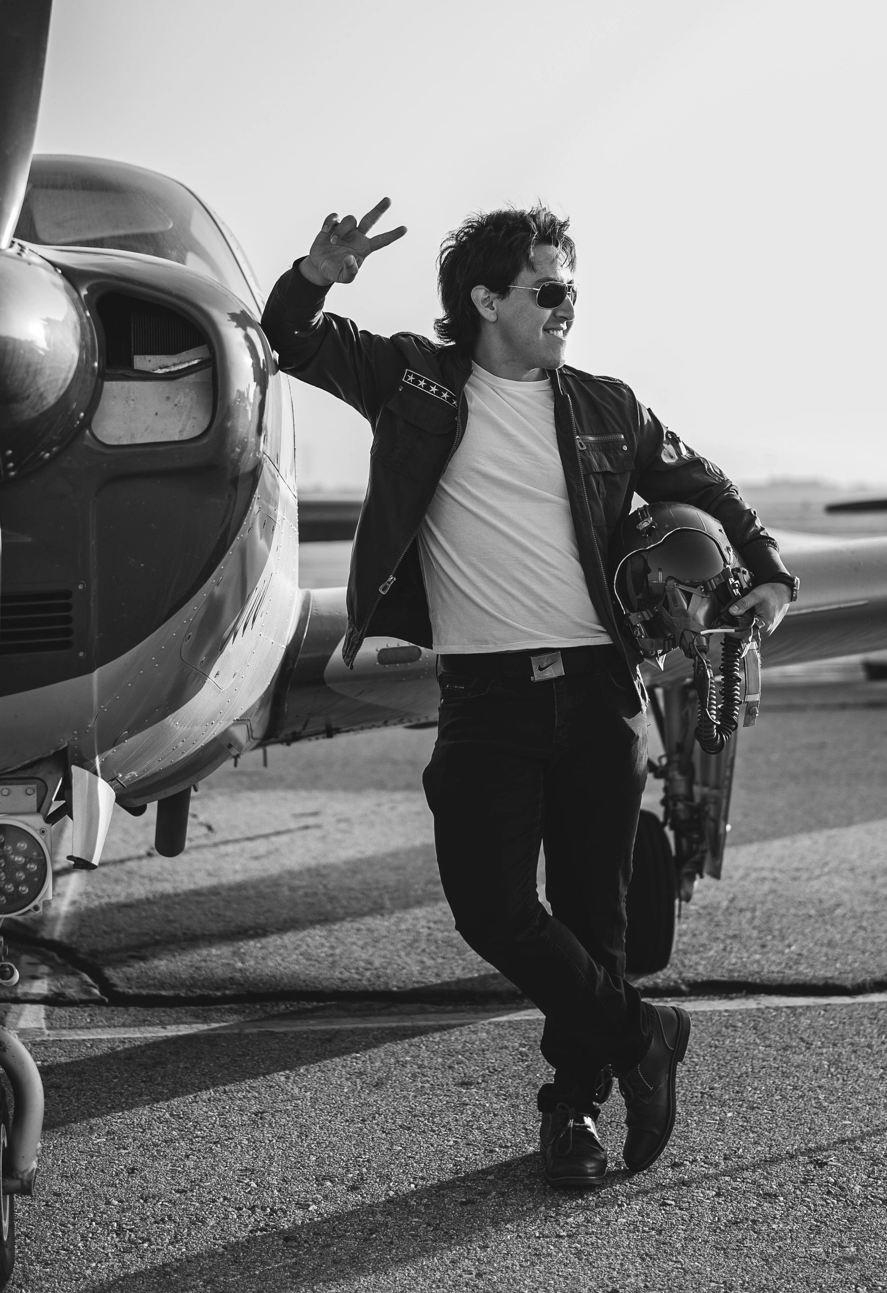 Man posing on propeller plane 