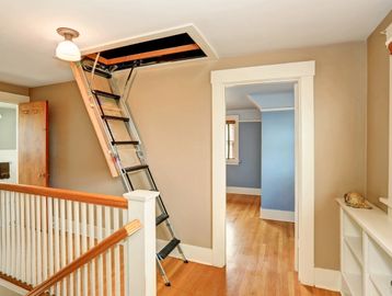 New attic stairs installed in the upstairs hallway of a customer's home.
