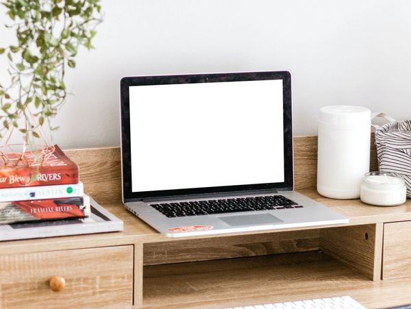 A desk with a laptop