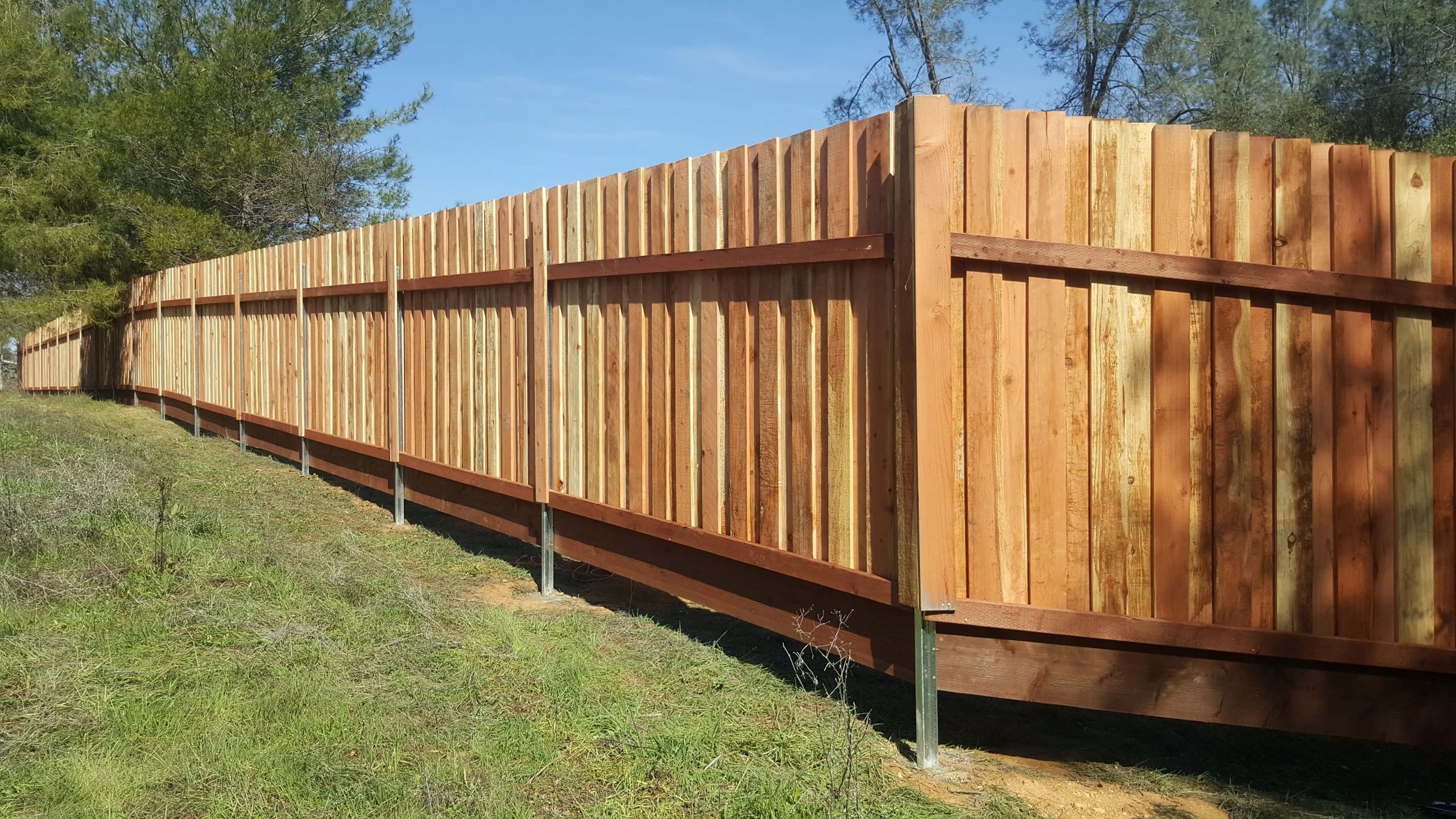 7' Flat Top BoardonBoard Fence w/ 2x12 Pressure Treated Kicker