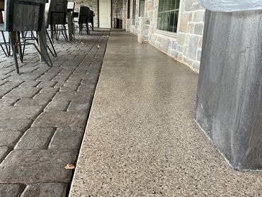 Garage concrete floor resurfaced with PolyChip flake system for garage floors.