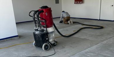 Grinding concrete surface before installing of garage floor system. 