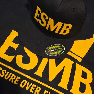 Close-up of ESMB Pressure Over Everything merchandise