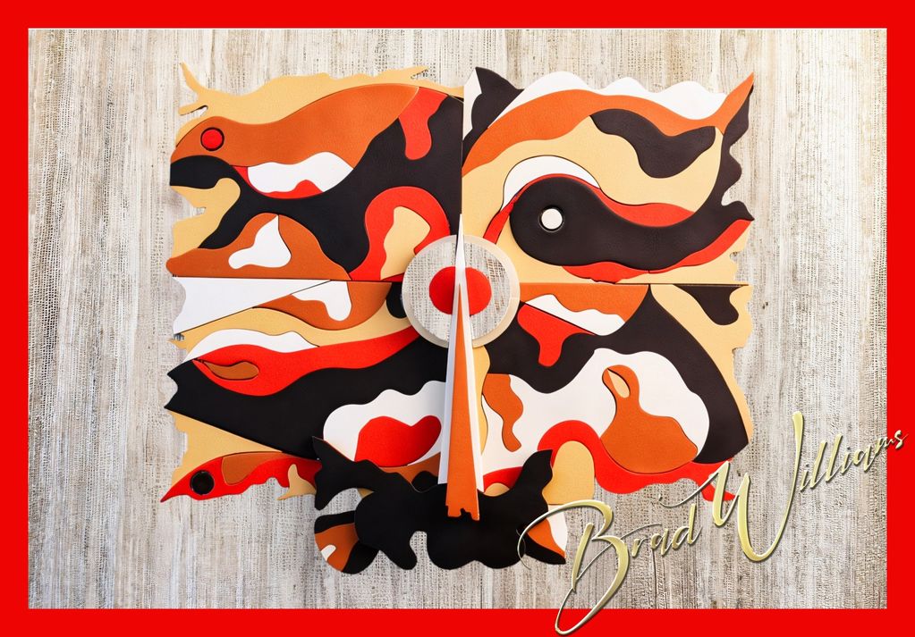 Abstract wall art with vibrant orange, black, and white shapes on a textured background.