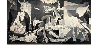 Black and white abstract mural with distorted human and animal figures.