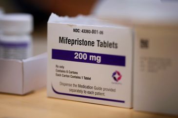 Box of Mifepristone 200 mg tablets on a table.