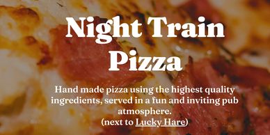 Close-up of a handmade pizza advertisement highlighting quality and inviting atmosphere.