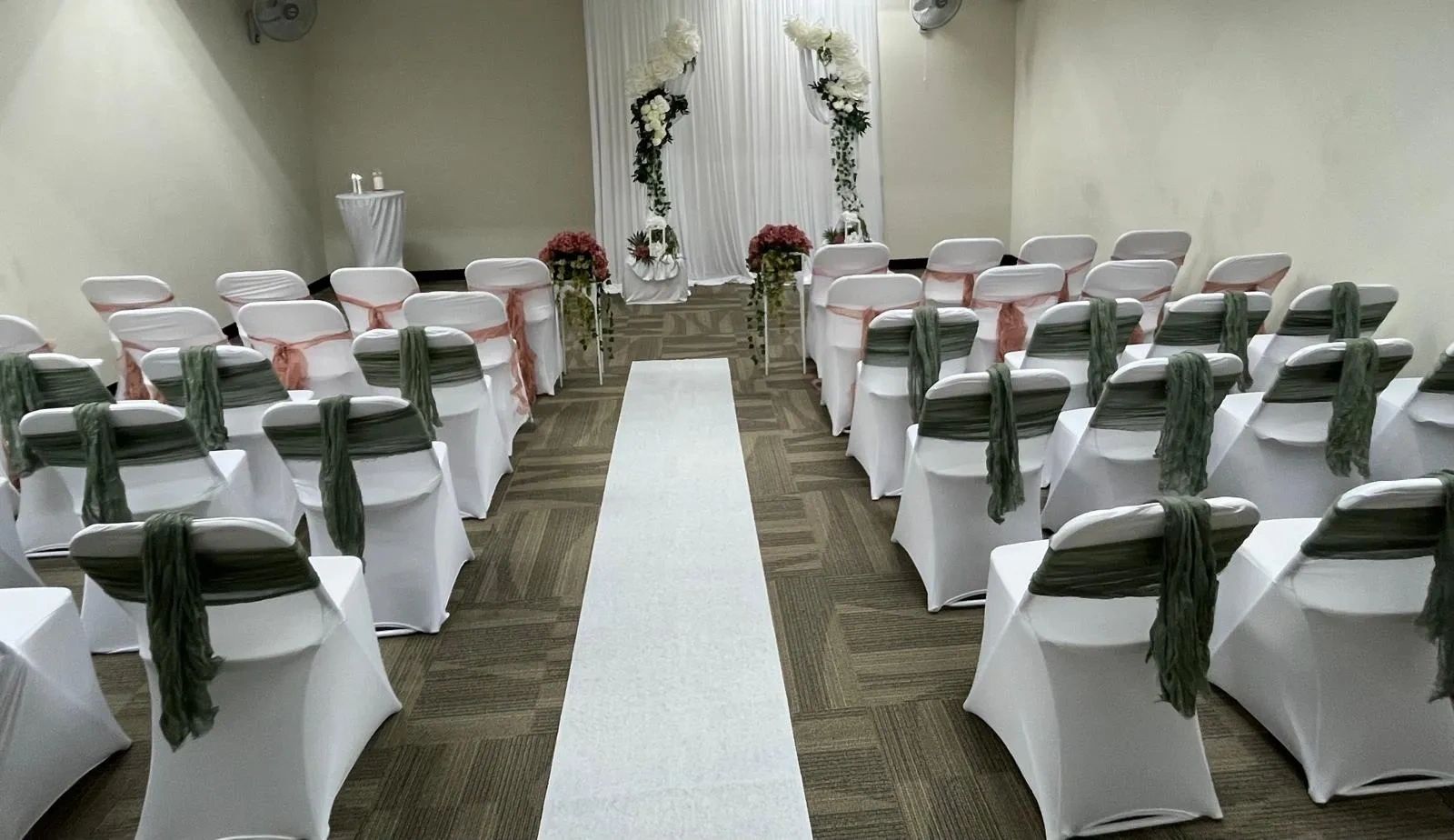 black people sitting in the chairs at a wedding at 550 hidden secret.