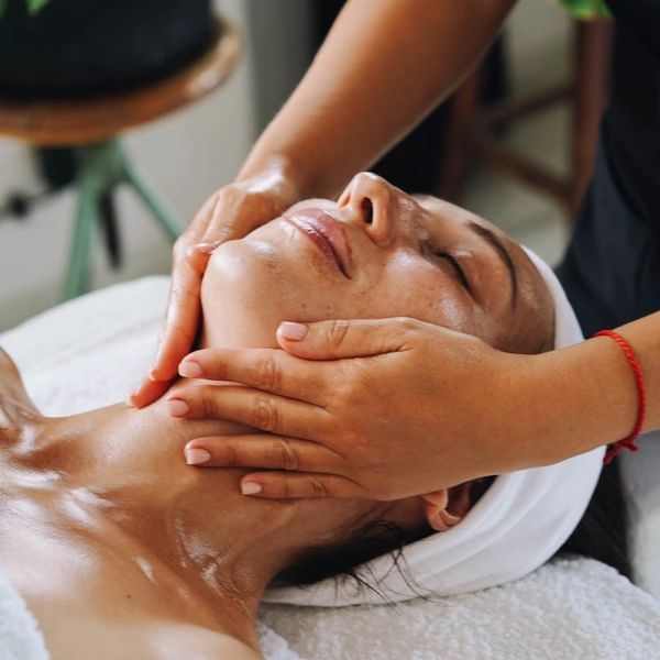 a woman getting a facial treatment