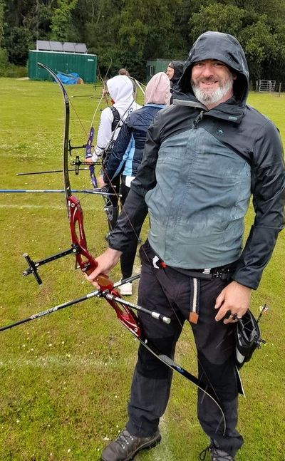 Happy Archer in Raincoat