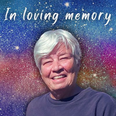 Portrait of an elderly woman with white hair, smiling against a starry background.