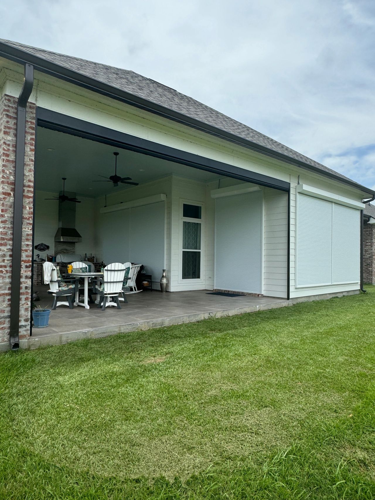 Retractable motorized hurricane shutters