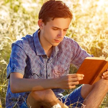 Young man reading a Bible